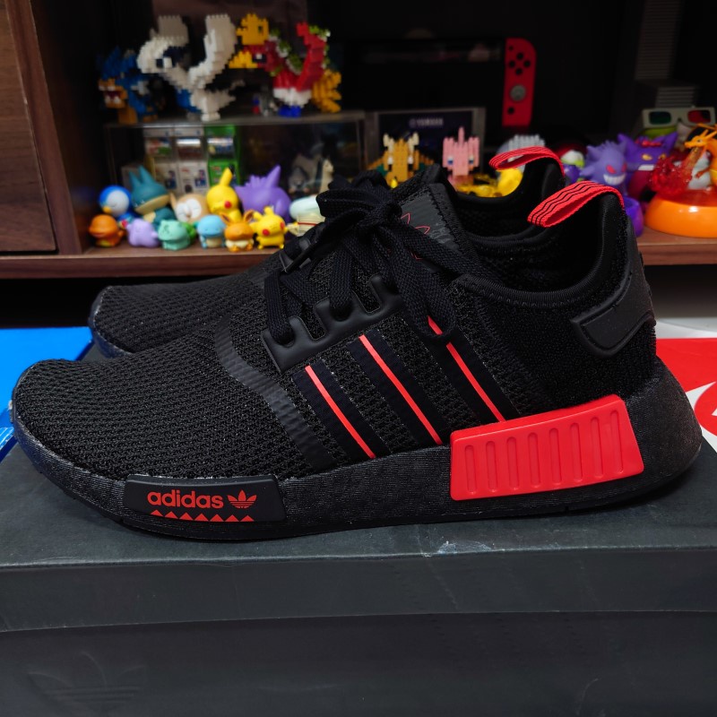 Adidas nmd black on sale with red and blue