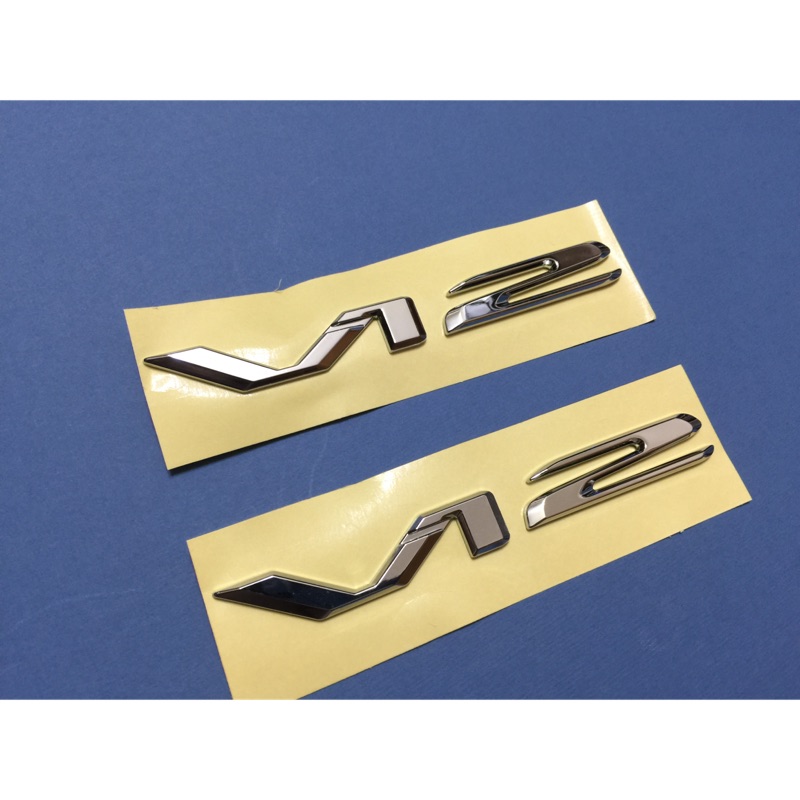 Pair Of Chrome V12 Badge Emblems – Fits Mercedes S65 AMG, CLK GTR, BMW E38 750iL